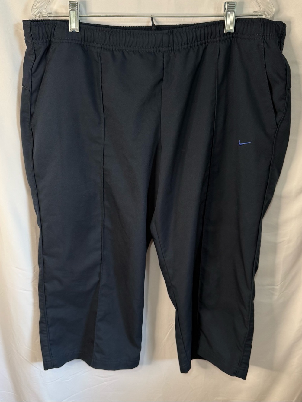 Nike Women’s Black Capri Pants with Blue Swoosh Accent